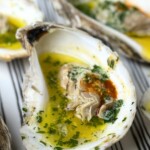 grilled oysters on a striped fabric towel