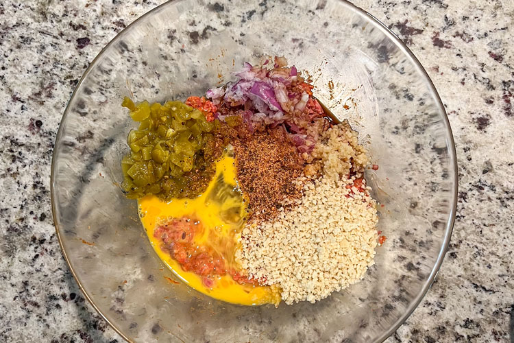 ingredients for meatloaf in a glass bowl
