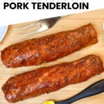 smoked pork tenderloin on a wooden board