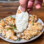 chicken wing covered in Alabama white sauce