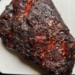 smoked pork butt on a plastic tray