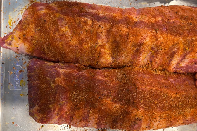 raw baby back ribs with seasoning