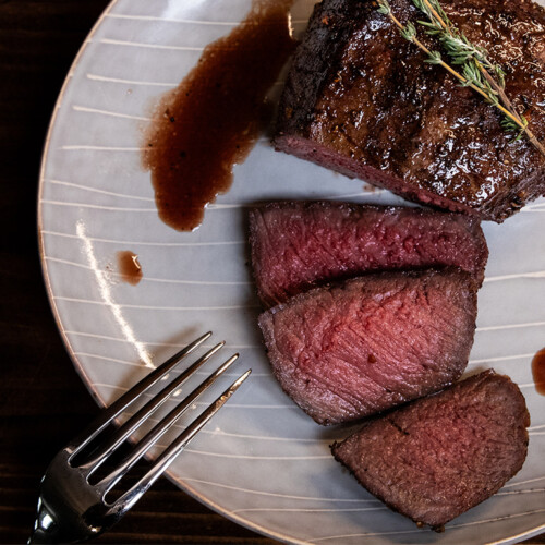 top sirloin steak cut and served on a plate