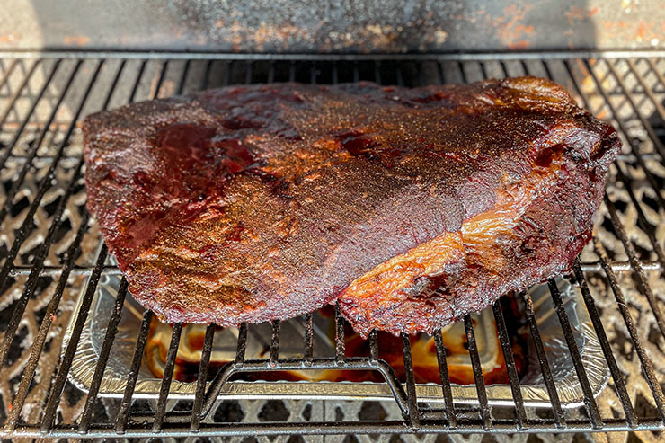 beef brisket smoking on a pellet grill
