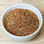 a white bowl with dry rub for smoked turkey