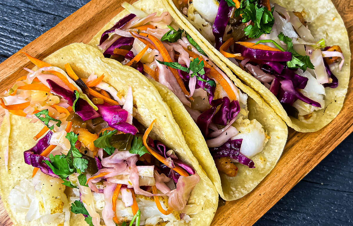 white fish tacos with pineapple and jalapeno slaw