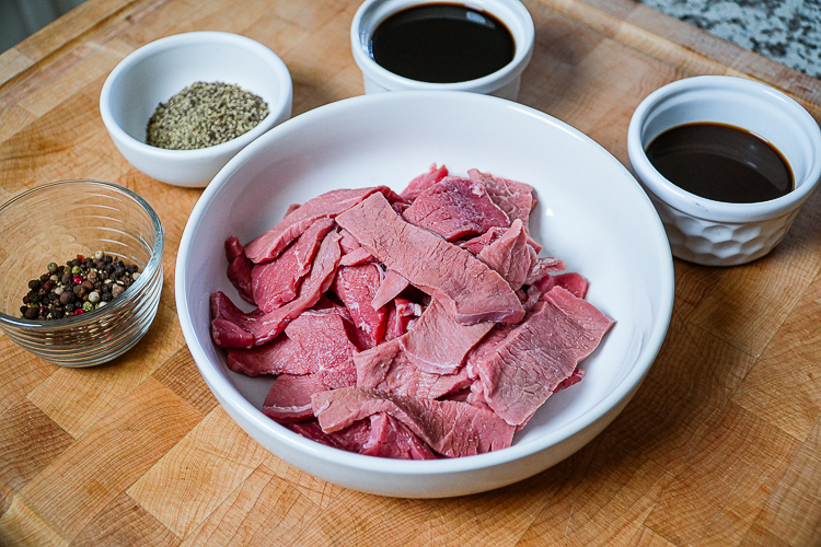 peppered beef jerky ingredients on a wooden board