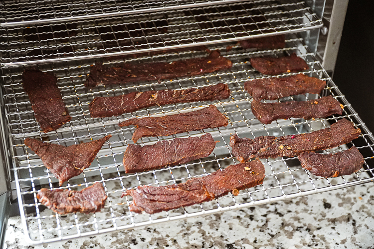 dehydrated peppered beef jerk in dehydrator