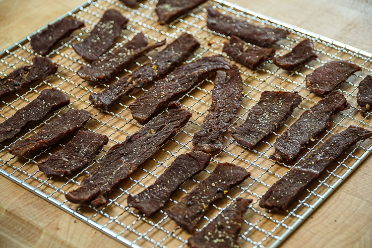 dehydrated peppered beef jerk on a wire rack