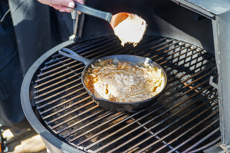 stirred chili cheese dip in the smoker