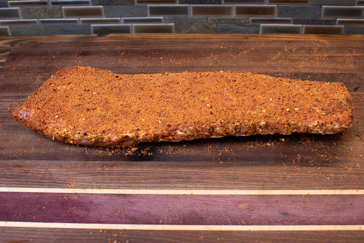 raw sesoned pork rib on a wooden board
