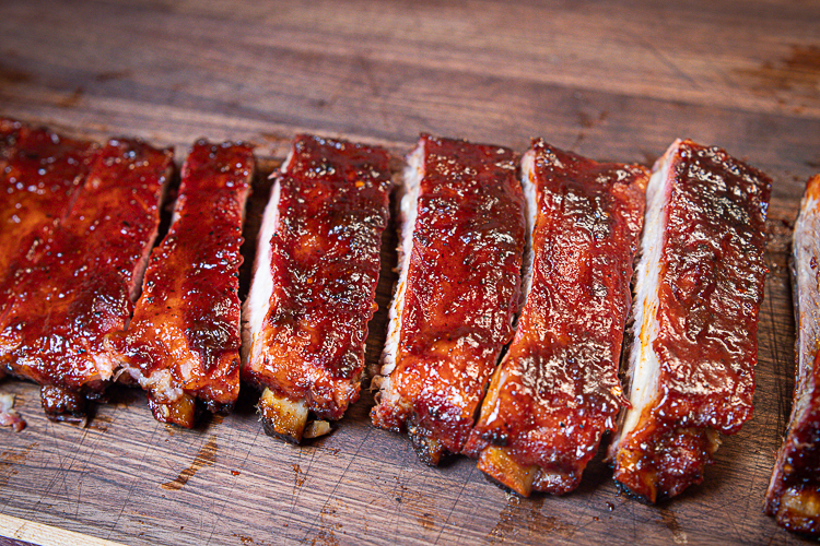 pork rib sliced on a wooden chopping board