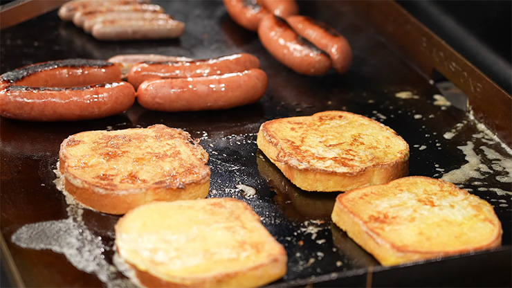 toast and sausages cooking on the Blackstone 28 inch Griddle