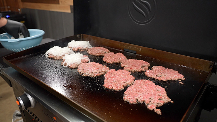 burger patties cooking on the Blackstone 28 inch Griddle