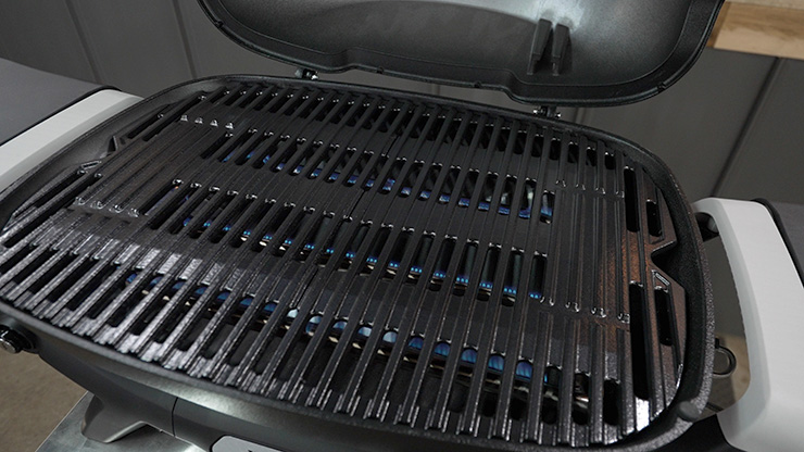 Weber Q+ gas grill with 2 burners burning
