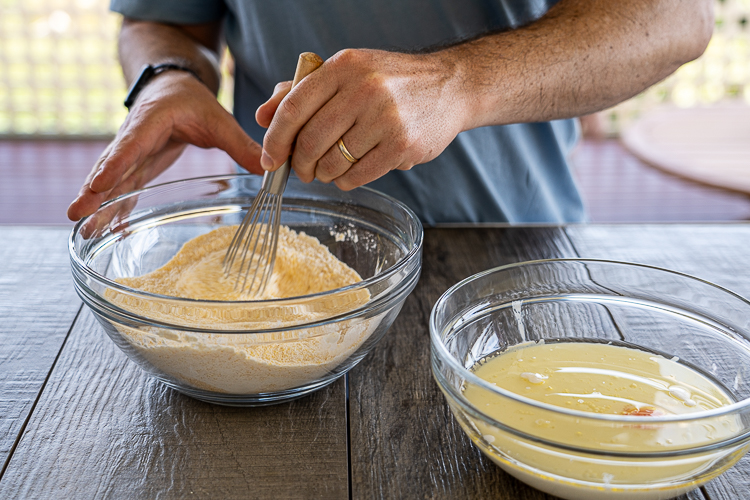 stirring the dry ingredients of cornbread