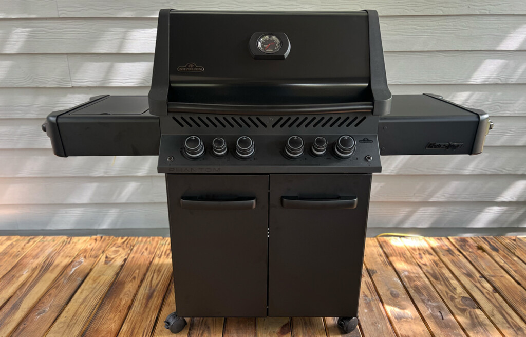 Napoleon Phantom Prestige 500 gas grill infront of house