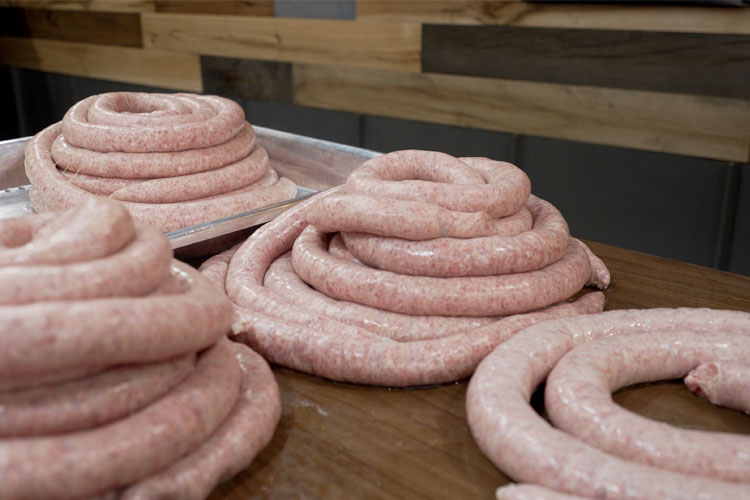 coils of polish sausage on a benchtop