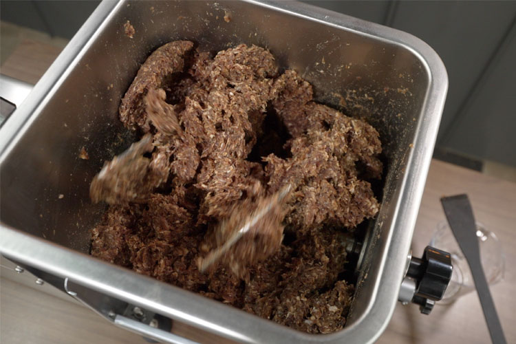 machine mixing raw sausage filling