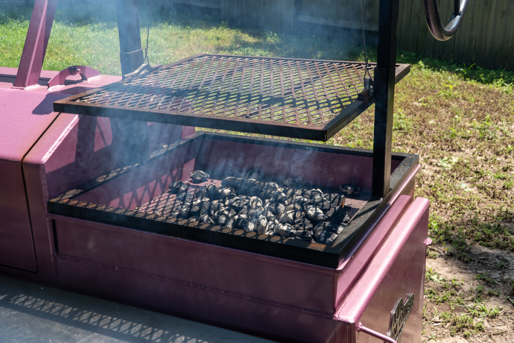 lit charcoal in the bottom of a santa maria grill