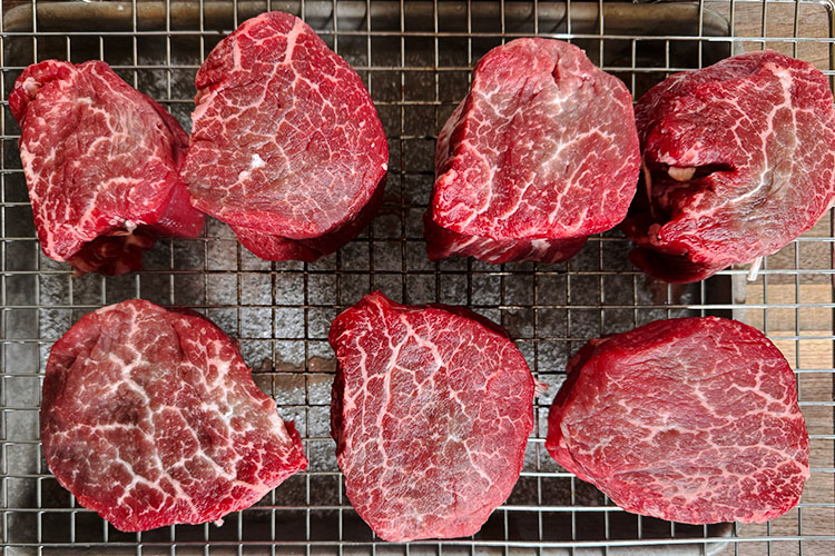 filet mignon steaks on a wire rack
