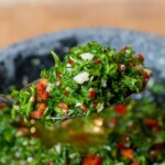 a teaspoon with homemade chimichurri sauce