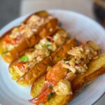 Grilled lobster rolls on a white plate