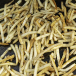 cooked French fries on the griddle
