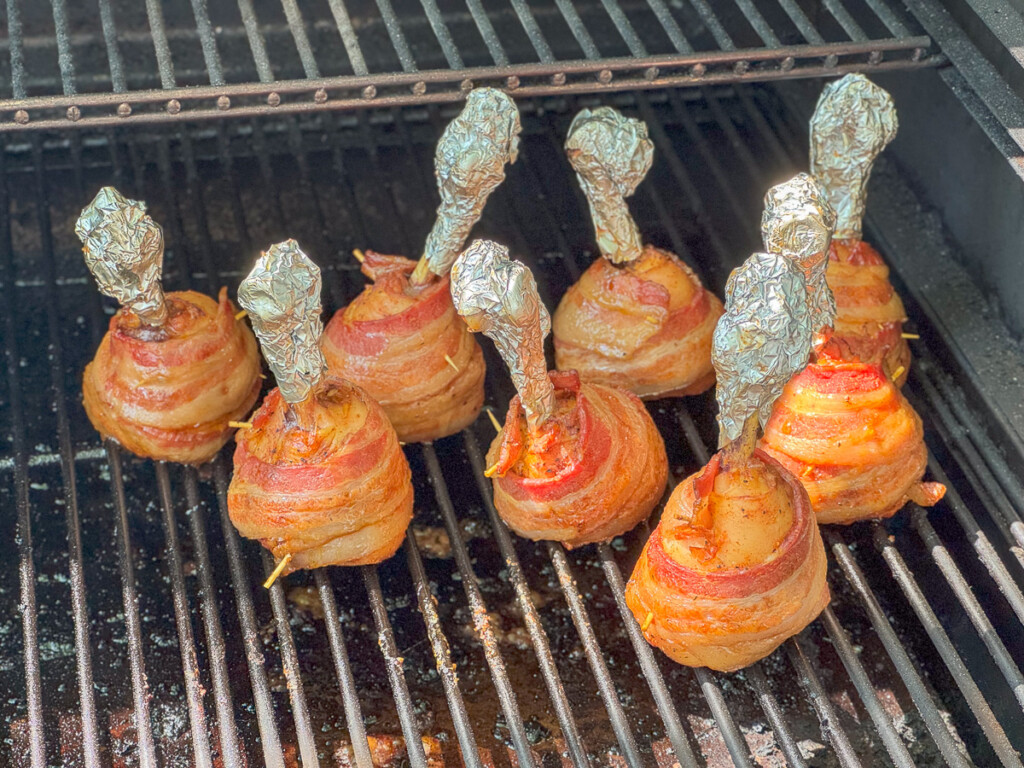 cooked chicken lollipops on the smoker