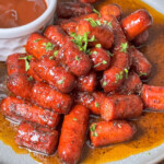 plate of hot dog burnt ends with dipping sauce