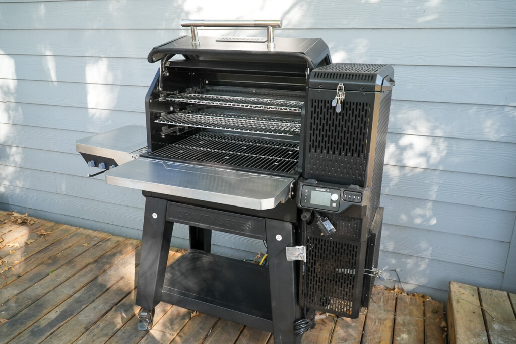 Fully assembled Masterbuilt Gravity GT grill with an open lid