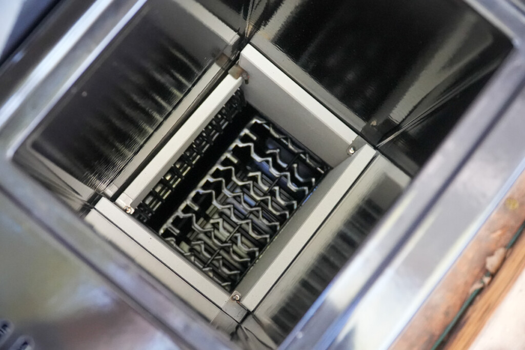 Inside view of the Masterbuilt Gravity XT charcoal hopper