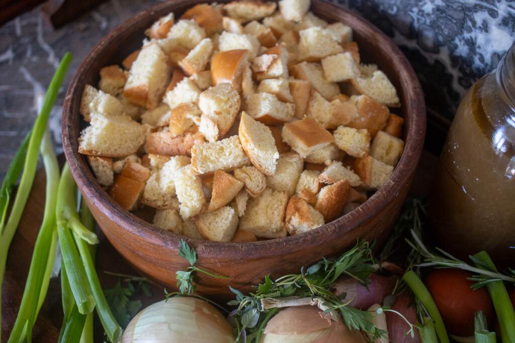 diced brioche bread in a wooden bowl