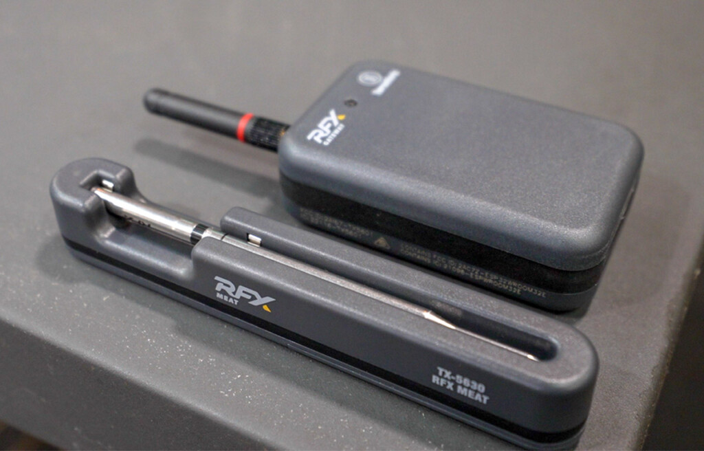thermoworks rfx probe in its charger next to the receiver.