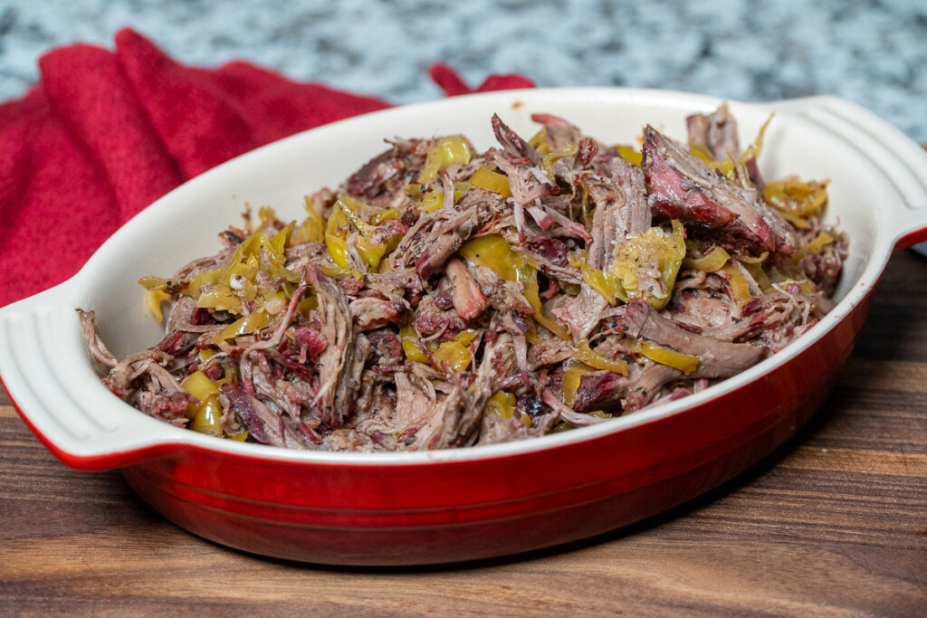 smoked mississippi pot roast in a red casserole dish