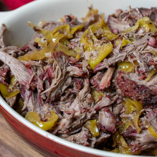 a casserole dish with smoked mississippi pot roast in it