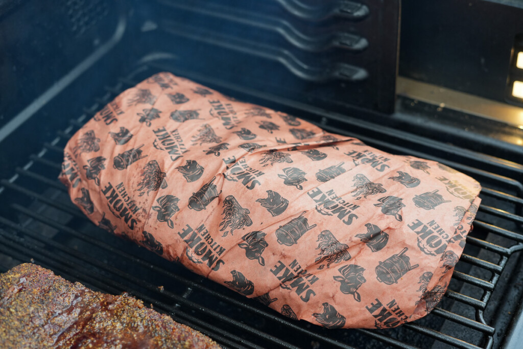 a wrapped brisket in the smoker