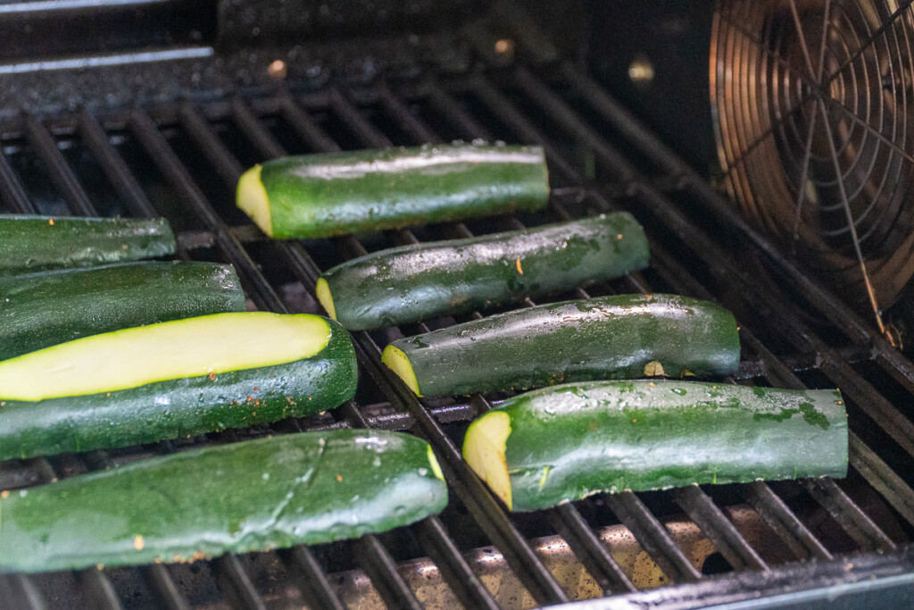 raw zucchini on the grill with cross hatch side down