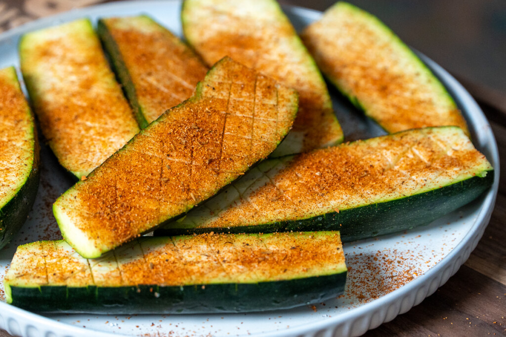 raw zucchini with seasoning on it
