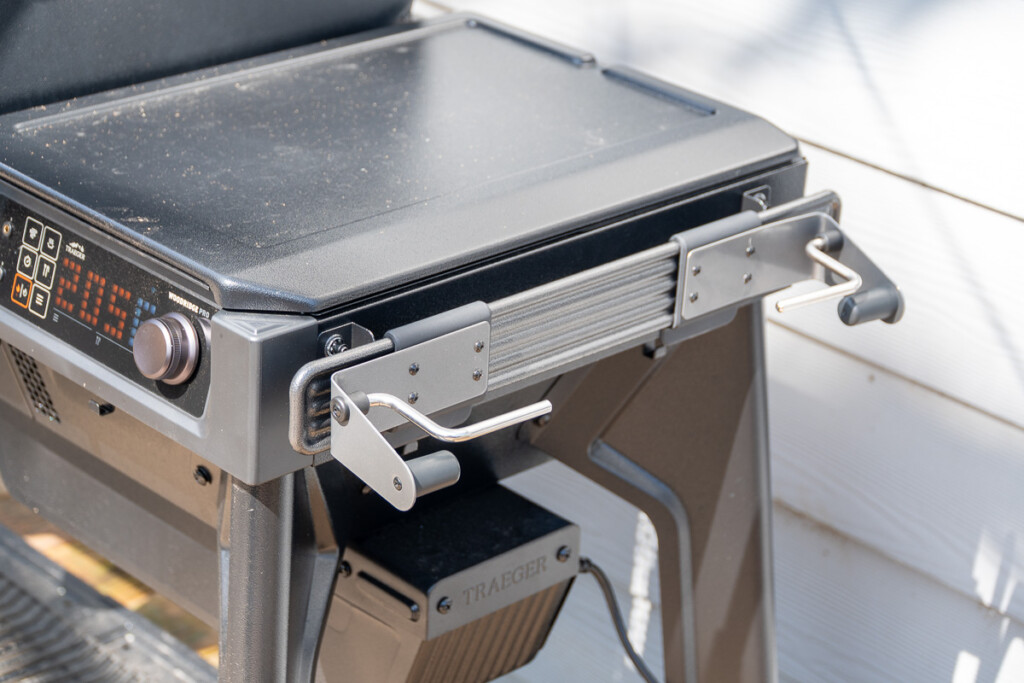 P.A.L. rail system on the Traeger Woodridge Pro fitted with a paper towel holder and accessory hooks.