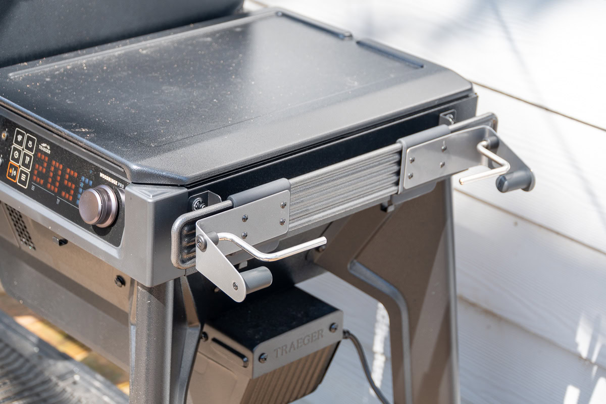 P.A.L. rail system on the Traeger Woodridge Pro fitted with a paper towel holder and accessory hooks.
