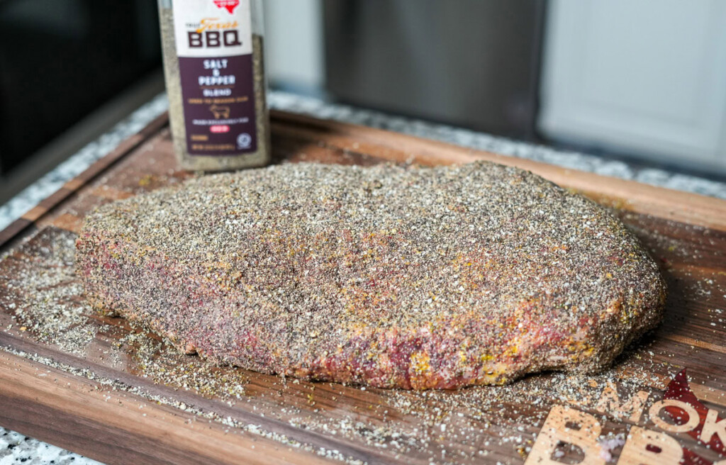 brisket seasoned on a large butcher block