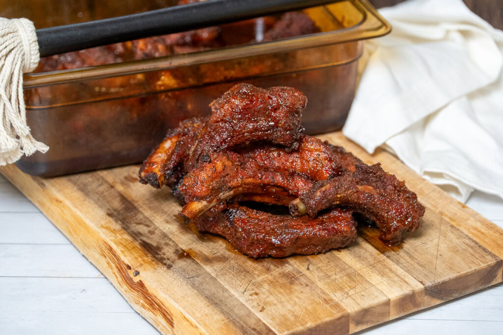 smoked party ribs on a wooden board