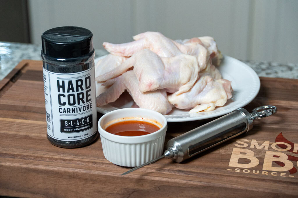 ingredients for smoked bat wings on a wood board