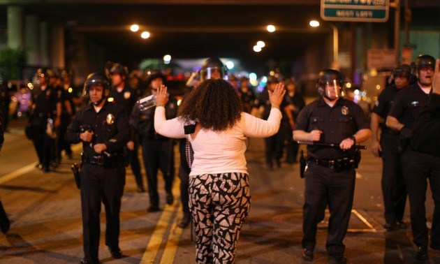 Protestor Holding Her Hands Up