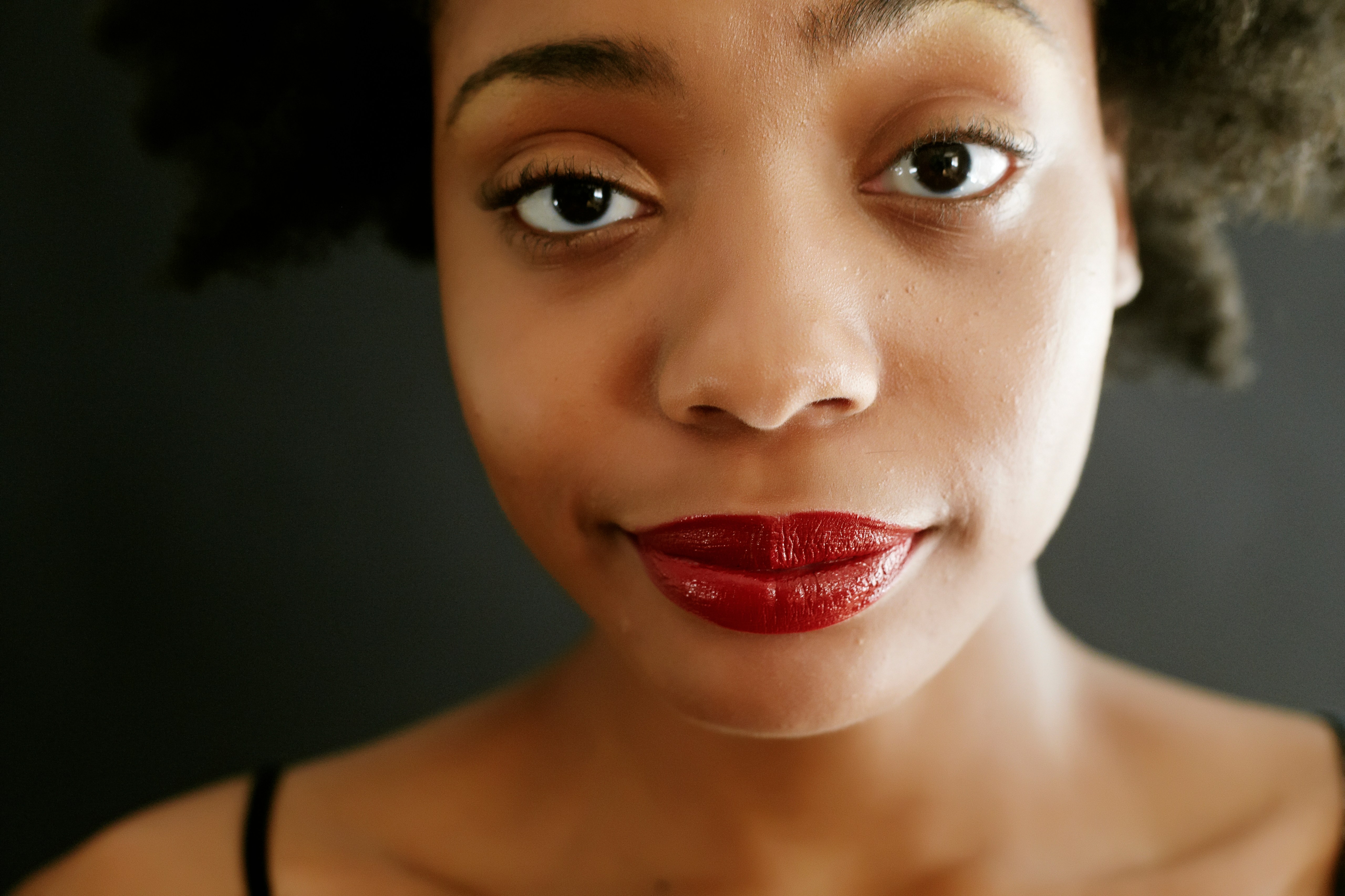 Close up of black woman smirking