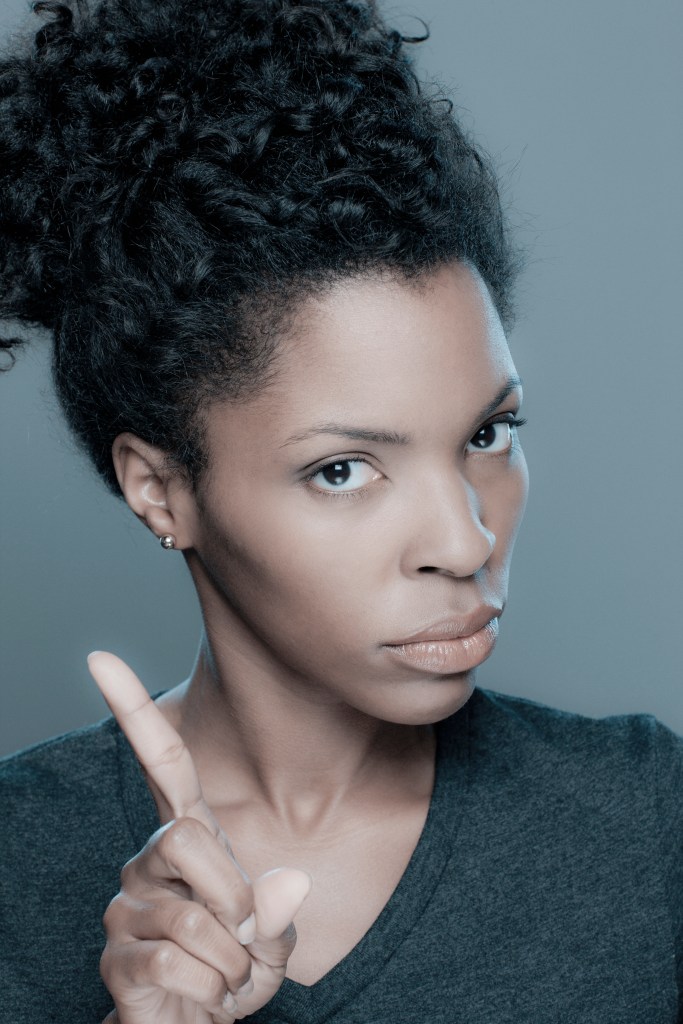 Studio shot of displeased young woman