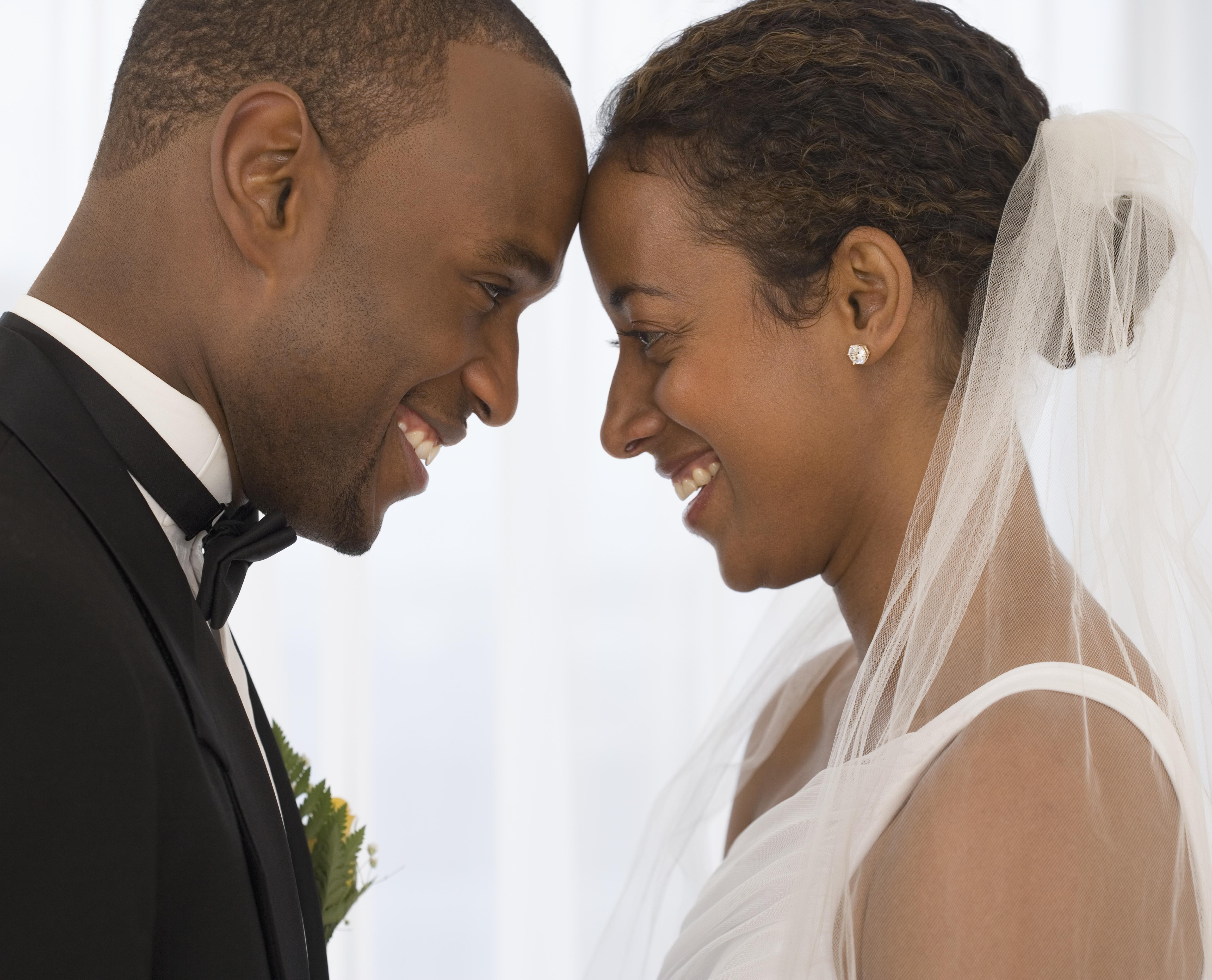 Bride and groom smiling at each other