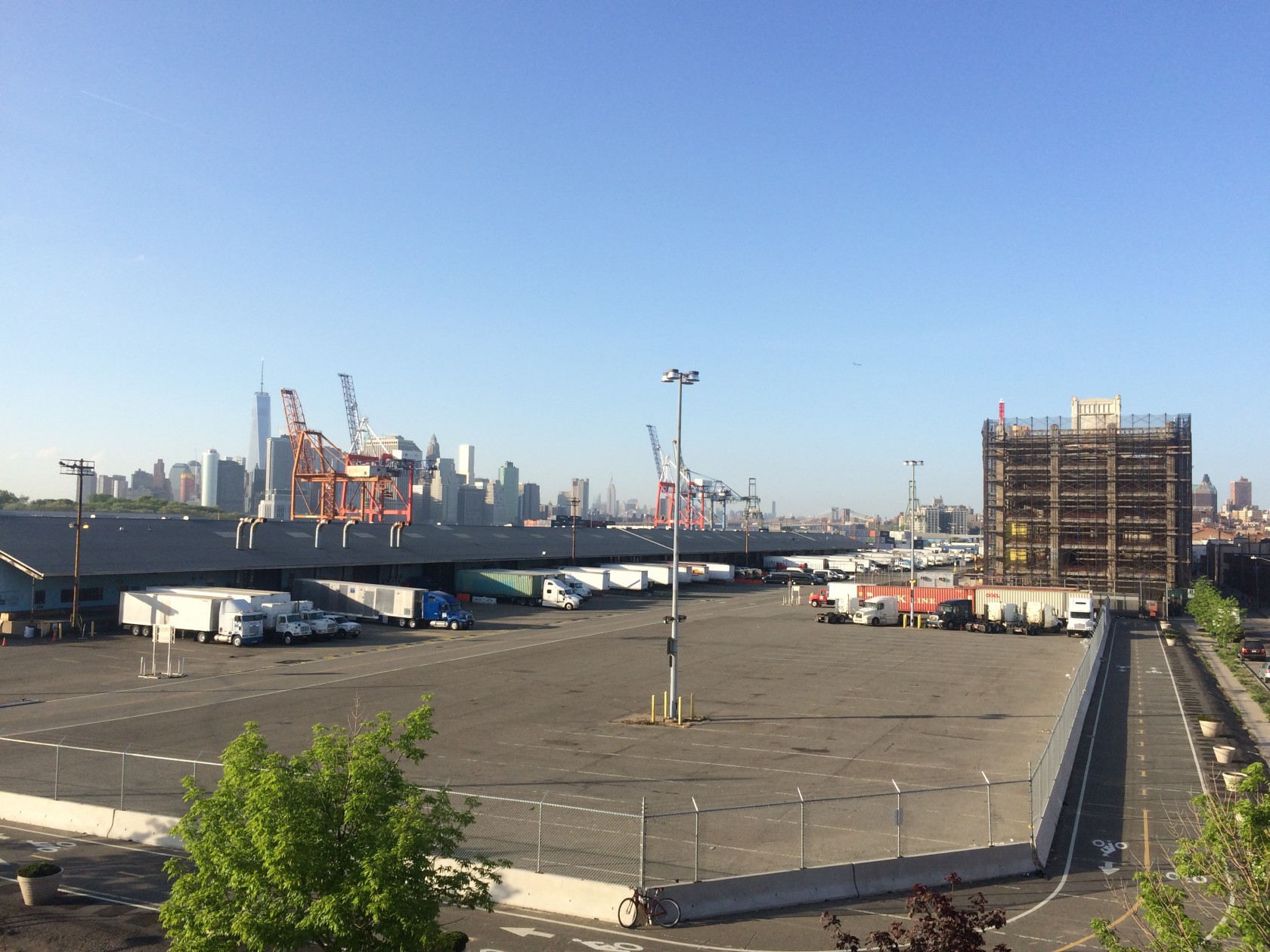 Trucks On Parking Lot Against Clear Blue Sky
