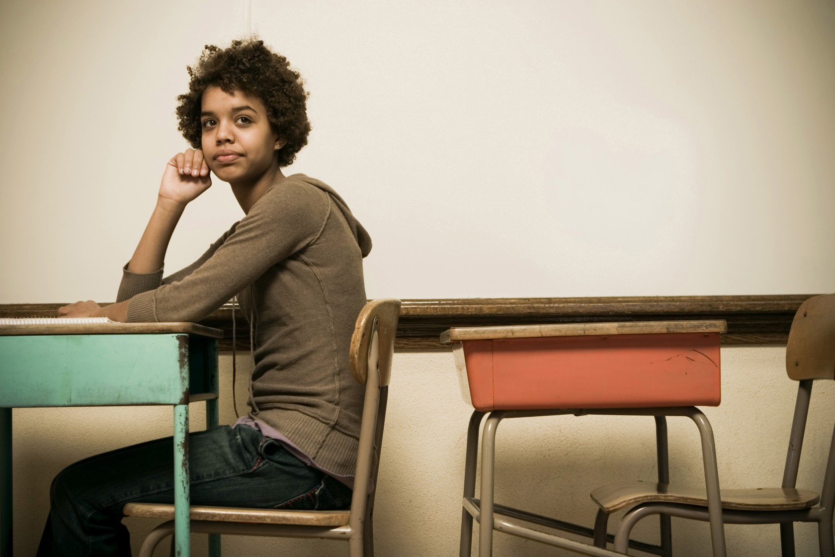 Student sitting at a desk in a classroom